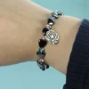 Palais du Rosaire Bracelet avec Perle Coeur hématite bleu/rose et médaille de Lourdes^ Bracelet Fantaisie