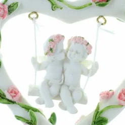 Palais du Rosaire Statue de deux Anges sur une balançoire dans un coeur en résine 11cm^ Statue Ange
